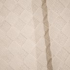 Textured cream washable rug with diamond pattern for modern home interiors.