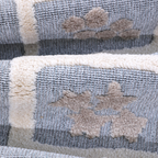 Soft gray Veiled Dreams Kids Woven Rug with plush pastel star patterns for playrooms.