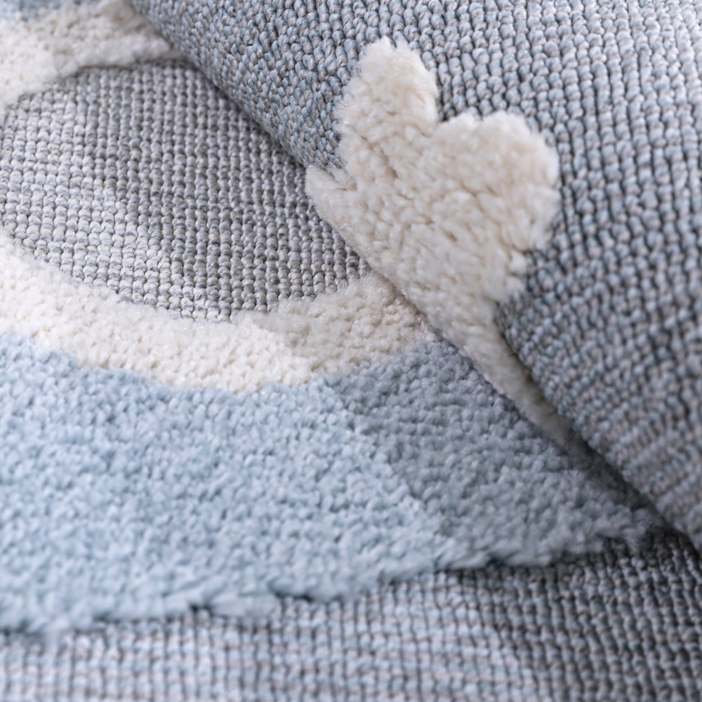 Soft blue kids rug with cream clouds, perfect for playful bedroom decor.