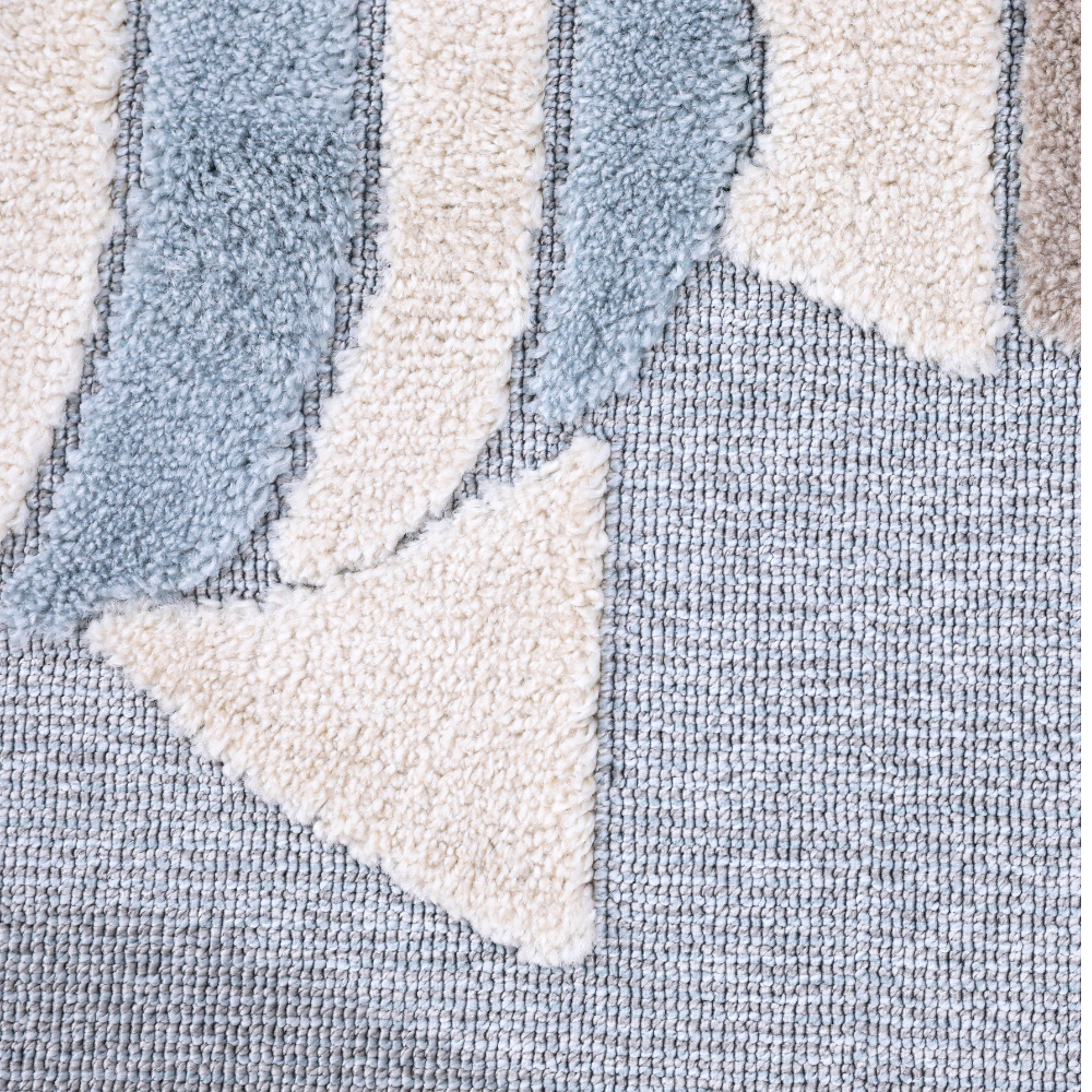 Abstract blue and cream kids rug design, perfect for playful bedroom or playroom.