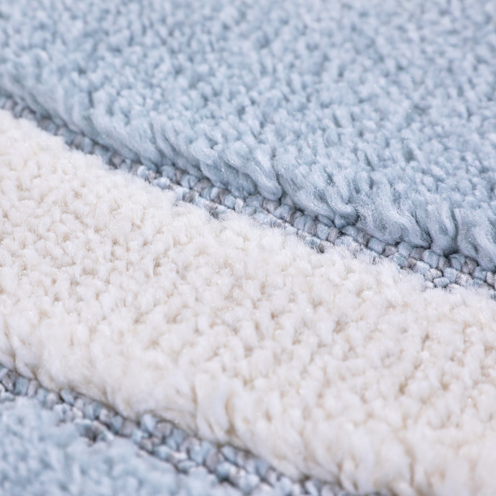 Textured blue and cream kids rug, ideal for playful bedroom or playroom decor.