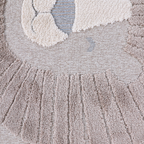 Distant Whispers Lion Woven Rug detail showcasing soft textures and earthy tones.