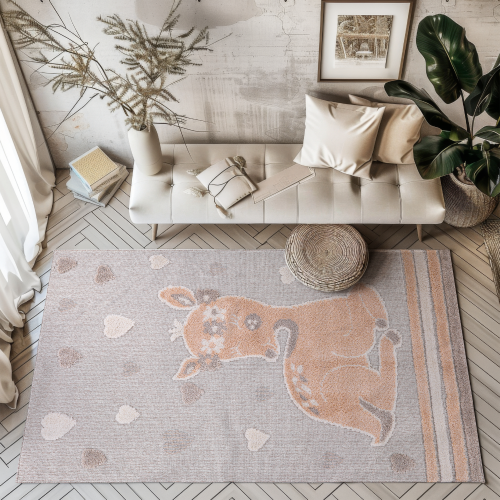 Quiet Lullaby Deer Woven Rug with a fawn and heart motifs in a stylish room setting.