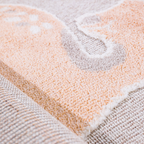 Soft texture of Quiet Lullaby Deer Woven Rug with fawn and heart design.
