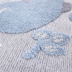 Gentle Tides Whale Rug close-up with soft textures and pastel whale design.