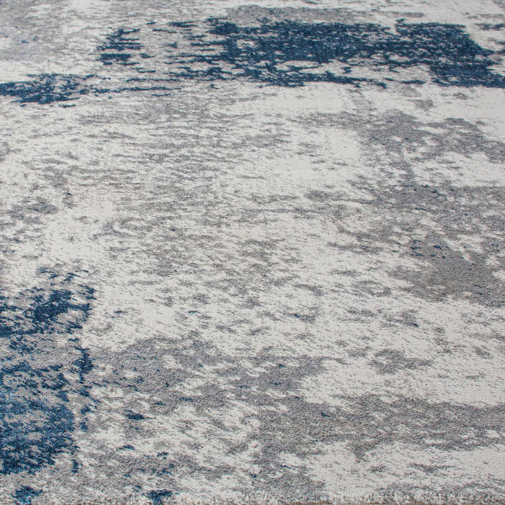 Sage abstract textured rug in blue and gray, ideal for stylish washable home decor.