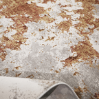 Ember Abstract Textured Rug with gray, red, and gold abstract design