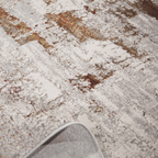 Willow Abstract Textured Rug featuring modern gray, white, and orange abstract design.