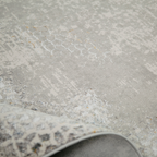 Elegant gray textured rug with honeycomb pattern for contemporary home styling.