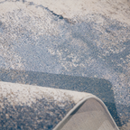 Mira Abstract Textured Rug in blue hues, soft texture, and machine-washable design.