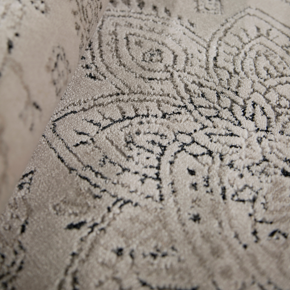 Finn Vintage Textured Rug featuring elegant beige and gray floral design for home decor.