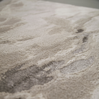 Beige and gray abstract textured rug from Bliss Waters with elegant design.