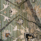 Green and beige Wren geometric textured rug with floral design