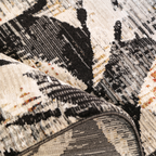 Textured lily flower rug in black, white, and orange featuring intricate design.