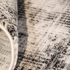 Luna Abstract Textured Rug in soft gray and cream, ideal for contemporary interiors.