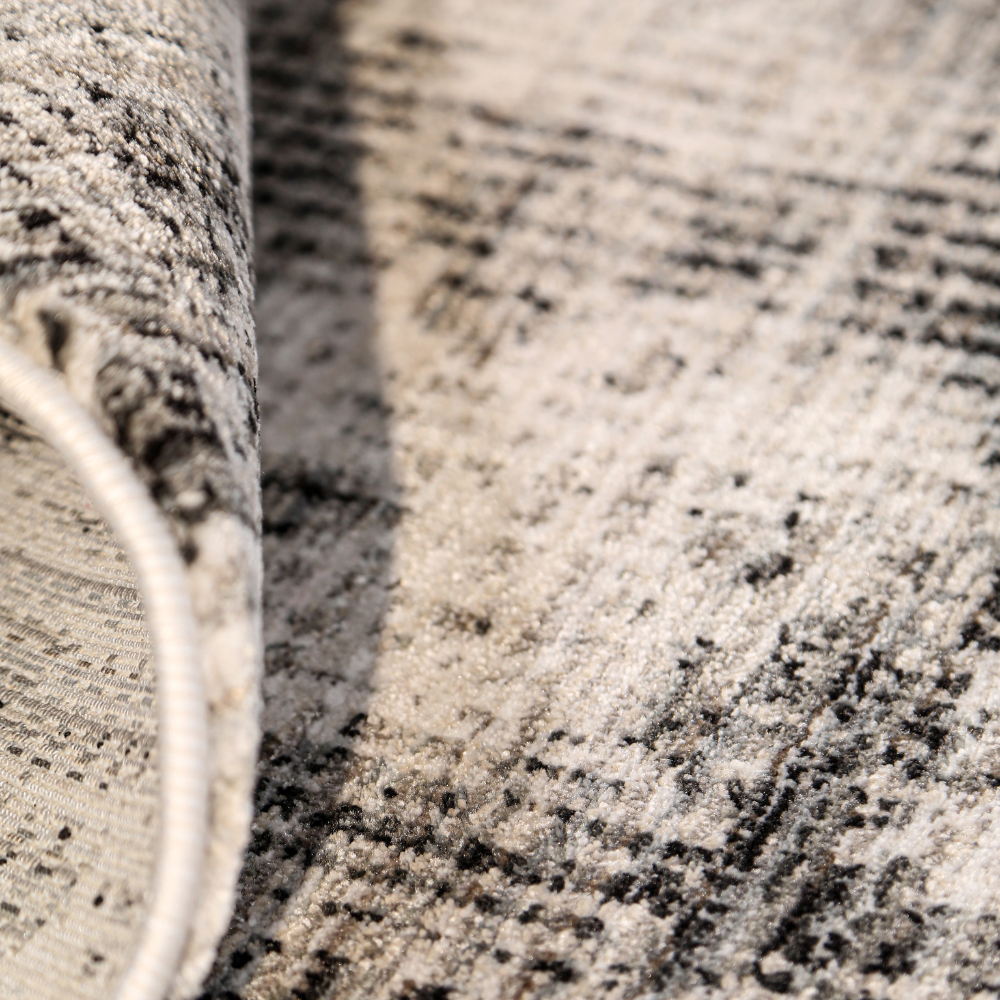 Luna Abstract Textured Rug in soft gray and cream, ideal for contemporary interiors.