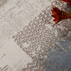 Amara Abstract Textured Rug showcasing beige, gray, and blue with floral accents