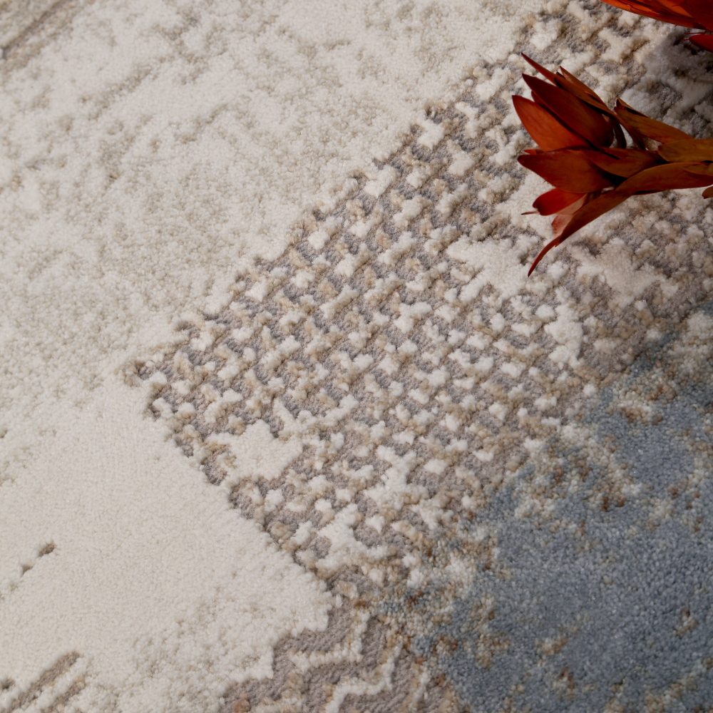 Amara Abstract Textured Rug showcasing beige, gray, and blue with floral accents