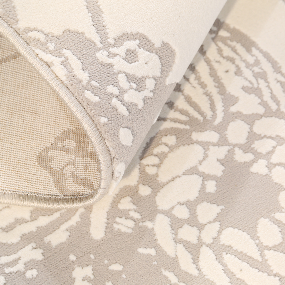 Celeste textured rug showcasing floral patterns in soft grey shades