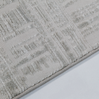 Textured cream and beige Melody Strip Rug with geometric design.