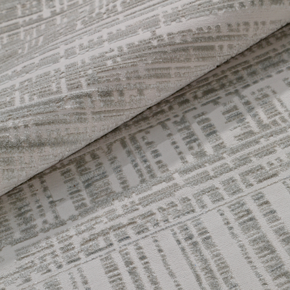 Cream and beige Melody Strip textured rug with modern geometric design.