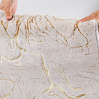 Pax Solid Textured Rug featuring gold accents and soft texture.