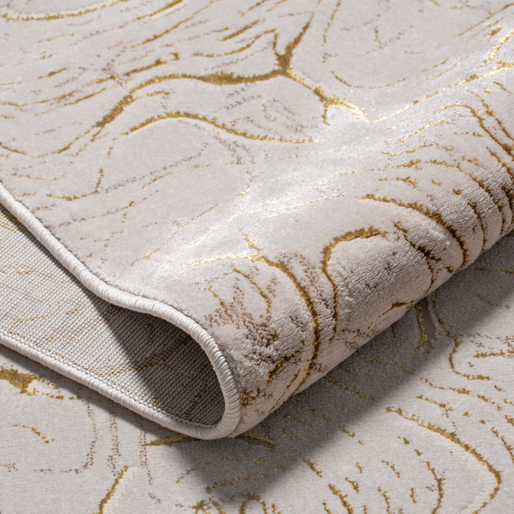 Pax Solid Textured Rug with elegant gold accents and soft, plush surface