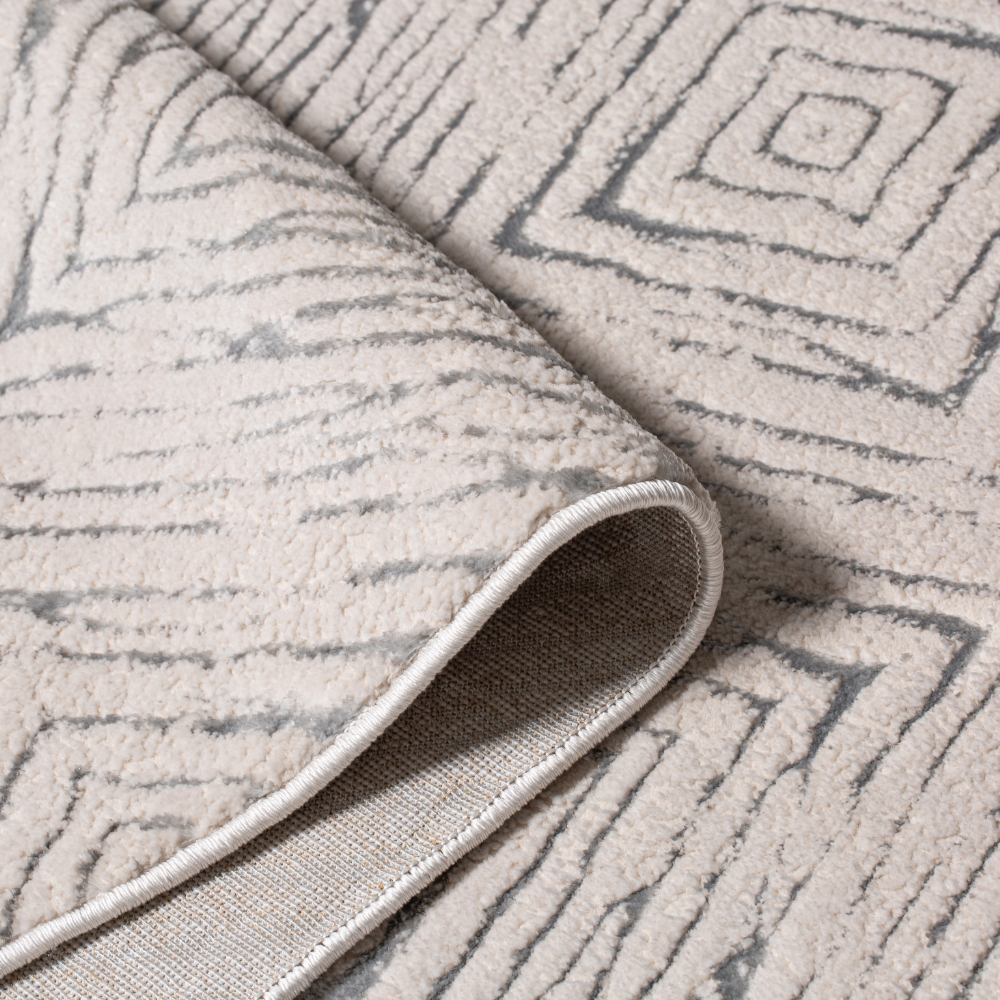 Indigo geometric textured rug corner with soft plush surface