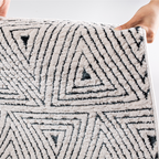 Zephyr Triangle Textured Rug with soft geometric design for stylish interiors.