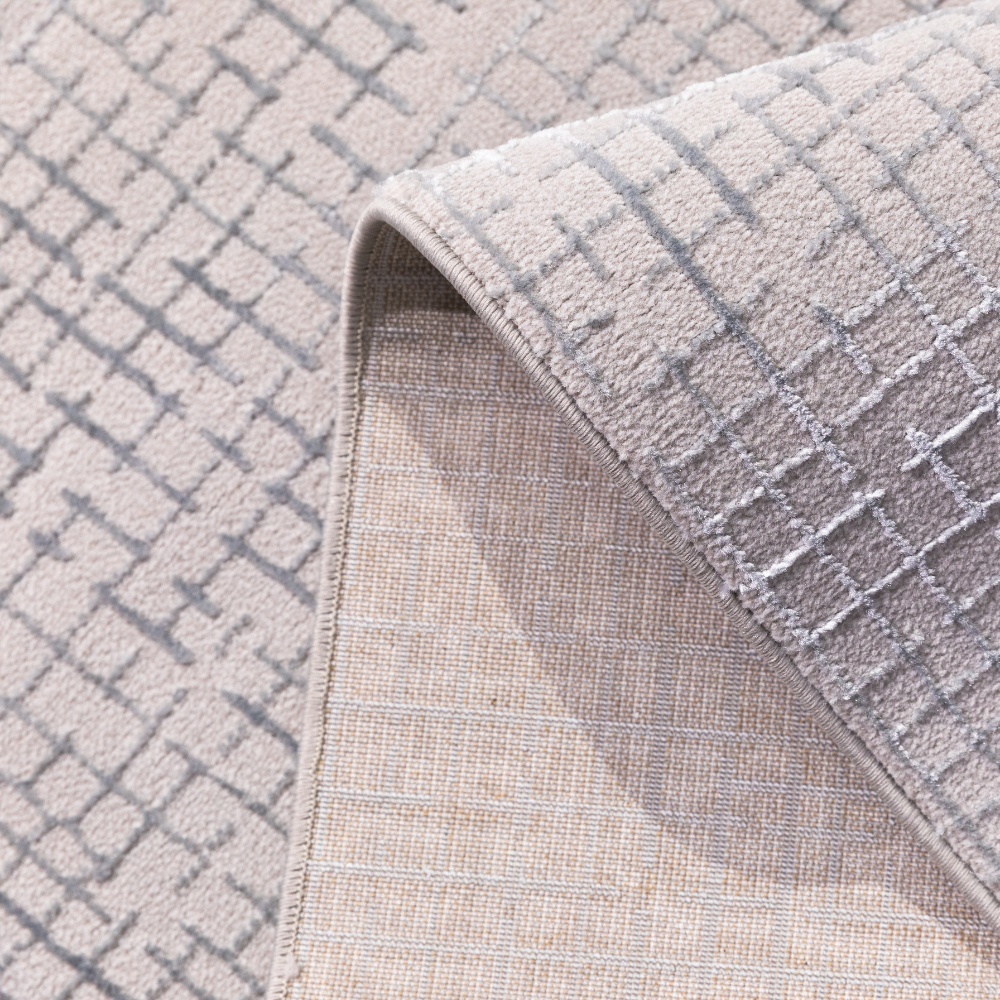 Zuri Checkered Textured Rug detail in soft gray, ideal for contemporary home design.