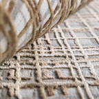 Theo Checkered Textured Rug with geometric pattern in soft beige and gray hues.