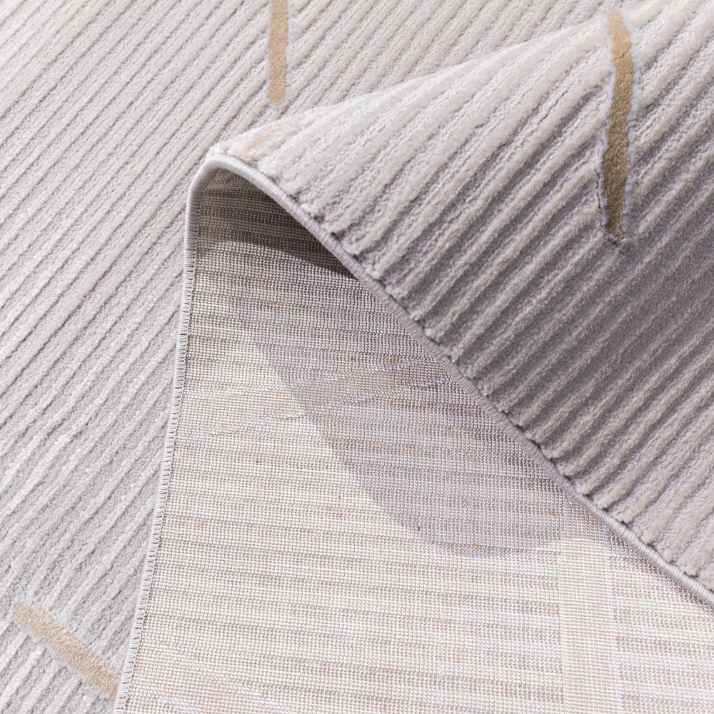 Close-up of Uma Abstract Textured Rug showcasing neutral geometric patterns