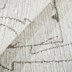 Textured beige rug with geometric design, perfect for modern home styling.