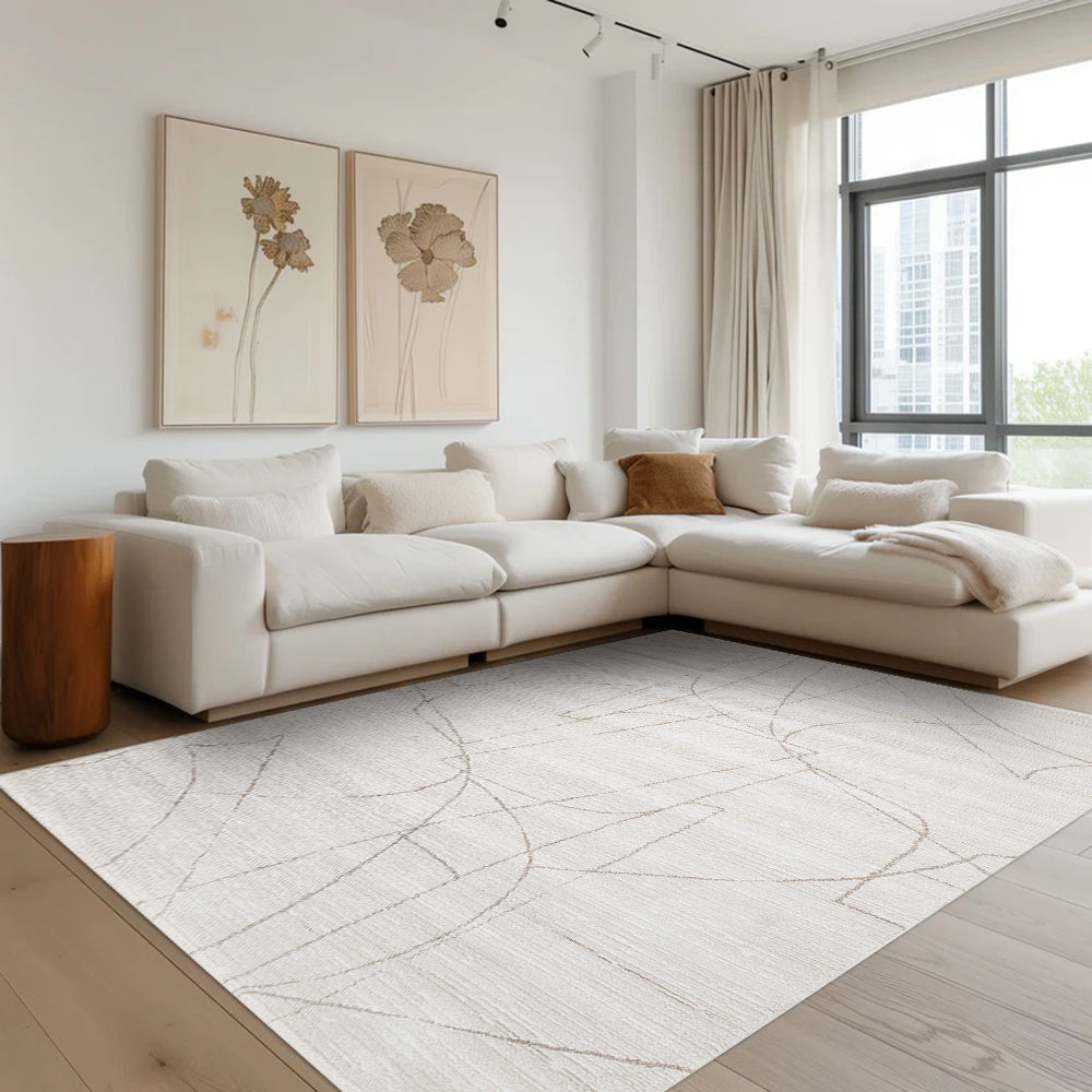 Thalion abstract textured rug in neutral tones, enhancing a modern living room design.