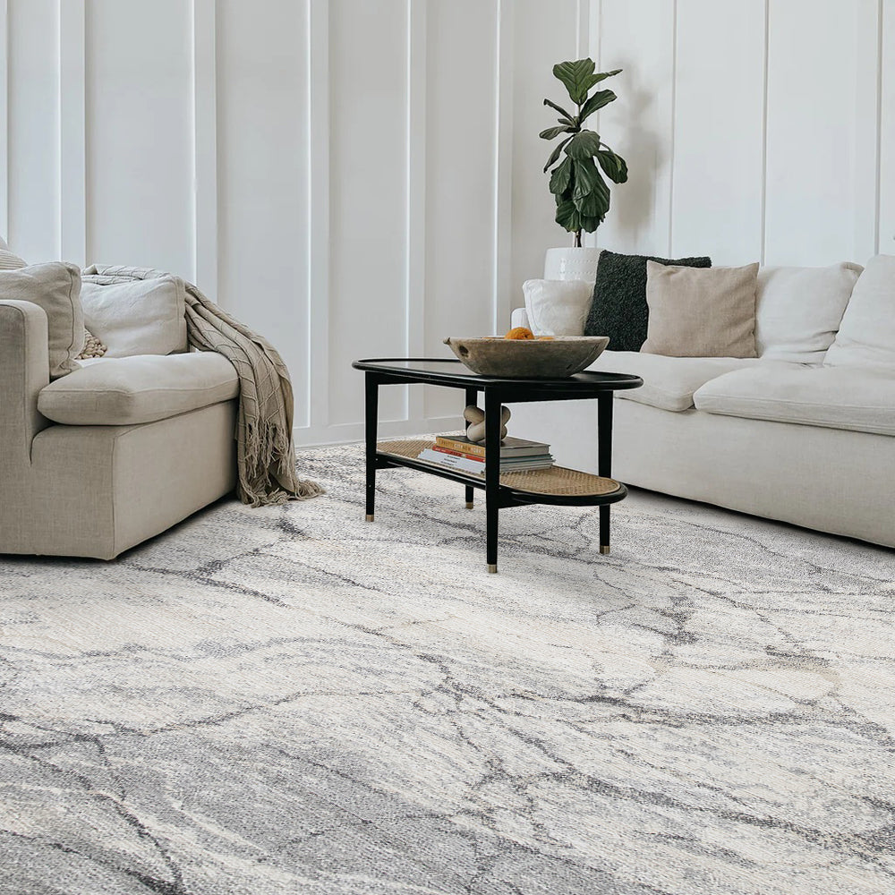 Drystan abstract gray and white marble rug in a modern living room setting