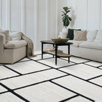 Modern living room with Eldrin geometric rug in cream and black pattern