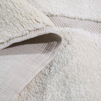 Lorien Stripe Textured Rug showcasing soft cream texture and layered construction.