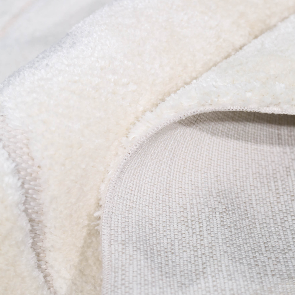 Cream Nyx geometric rug close-up showcasing soft texture and durability.