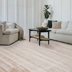 Beige checkered rug enhancing cozy living room decor with modern furniture.