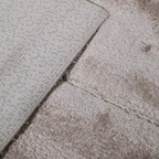 Soft light Callidora geometric rug detail highlighting texture and design.