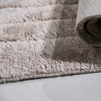 Close-up of Callidora geometric textured rug showcasing soft fabric and design