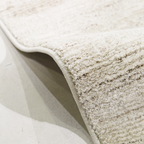 Light Romulus textured rug with soft fibers, ideal for contemporary home interiors.