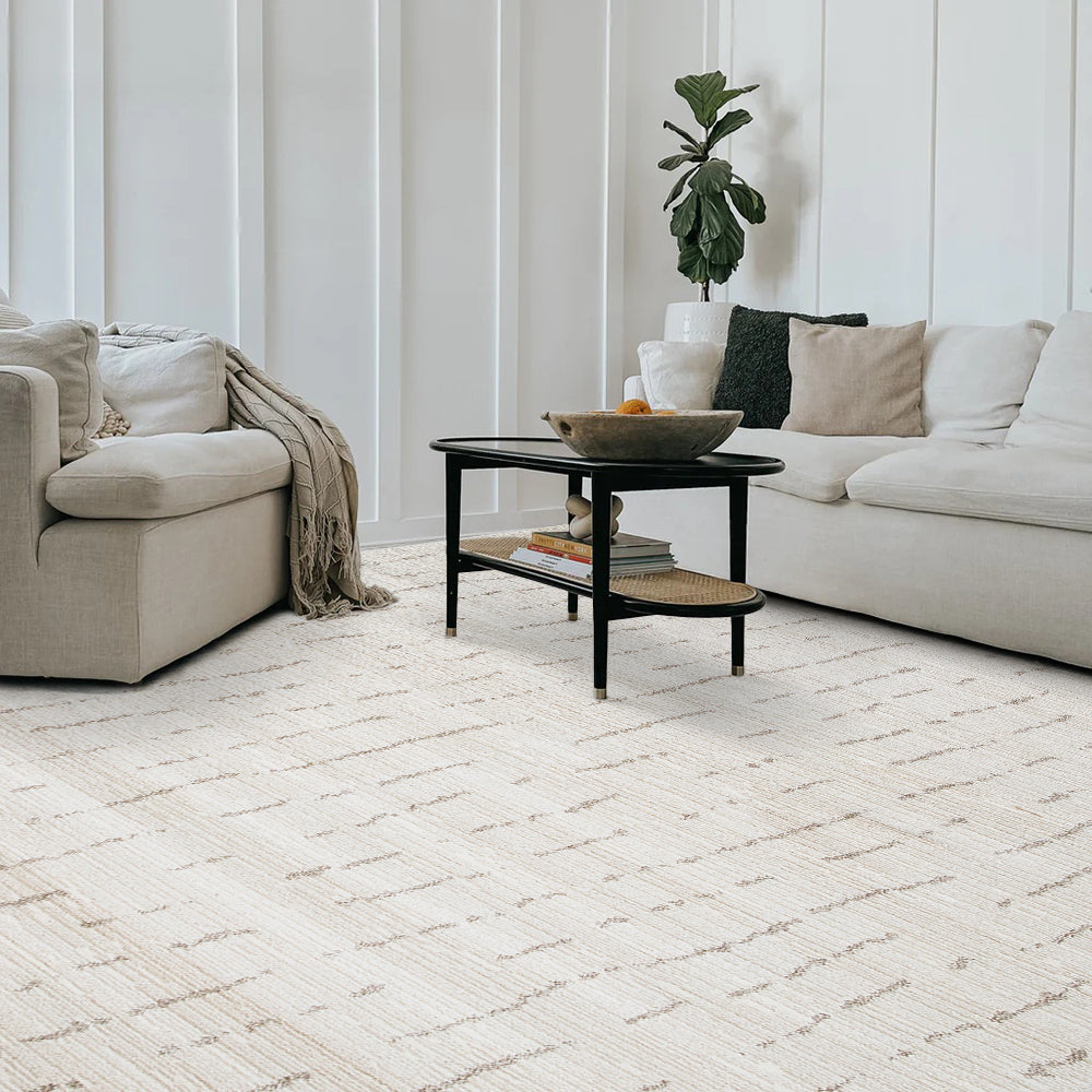 Iskander Stripe Textured Rug in cream, enhancing a stylish living room setting.