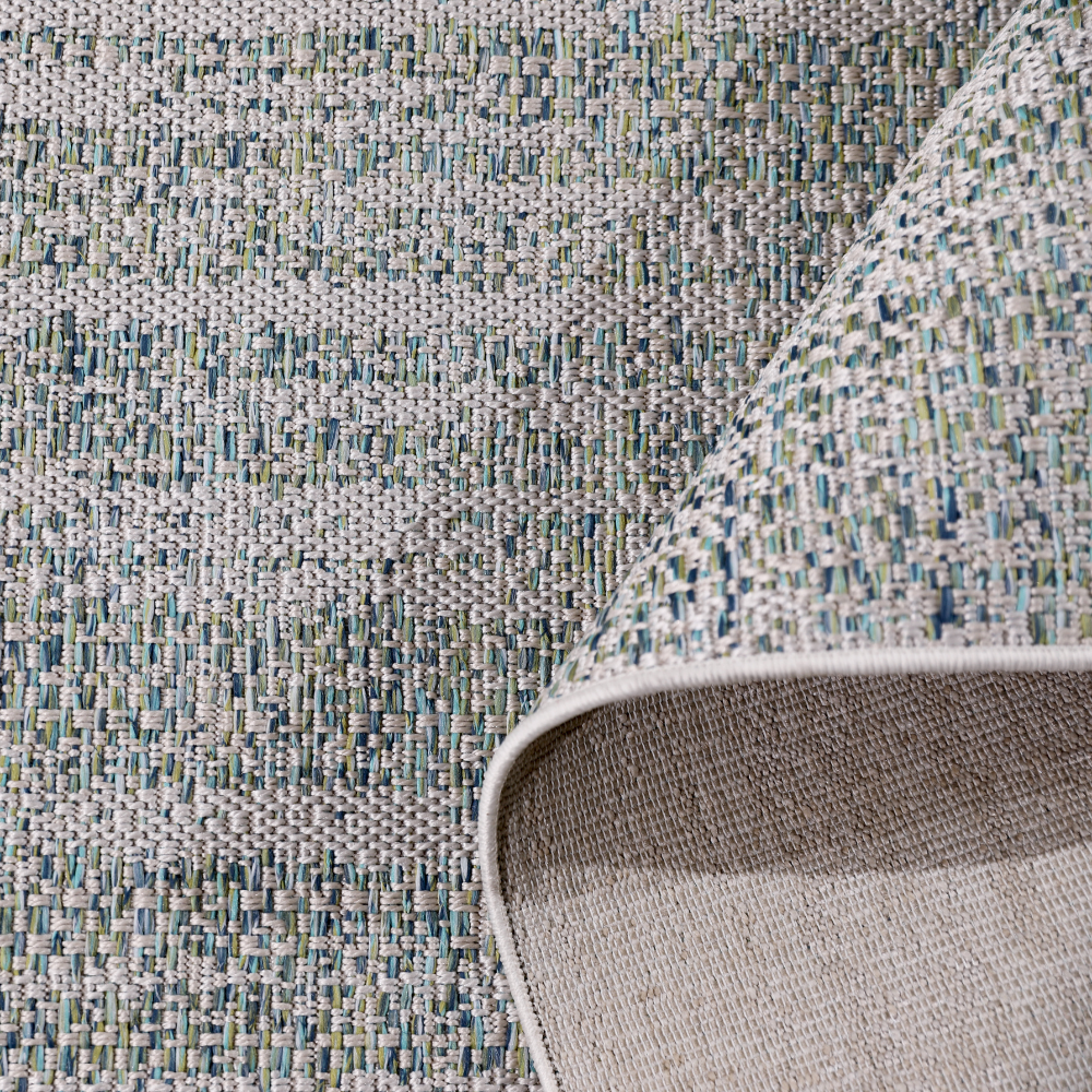 Stylish light gray braided rug with blue accents for home interiors