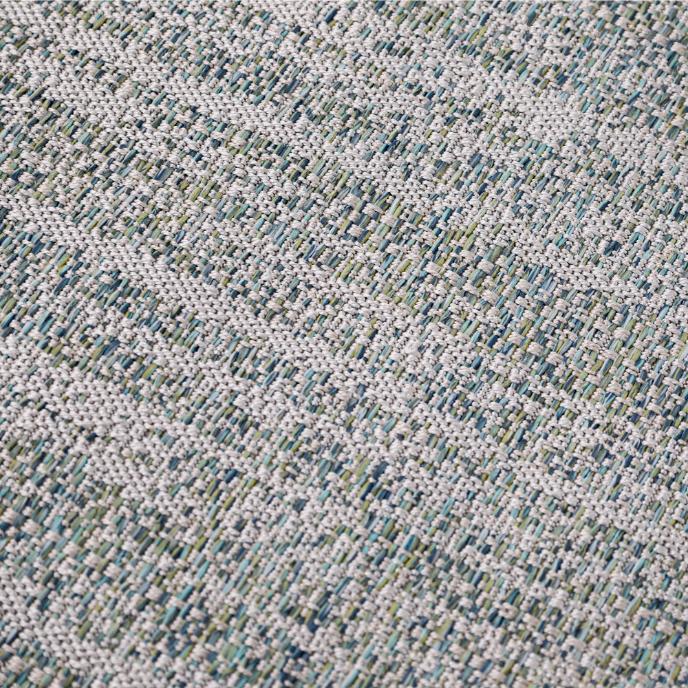 Light gray braided rug with blue and green accents for modern home decor