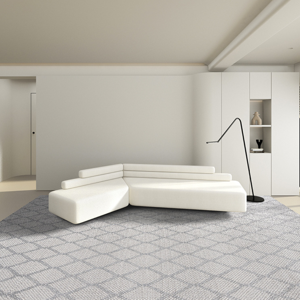 White sectional sofa on Magnus Stripes textured rug in modern living room